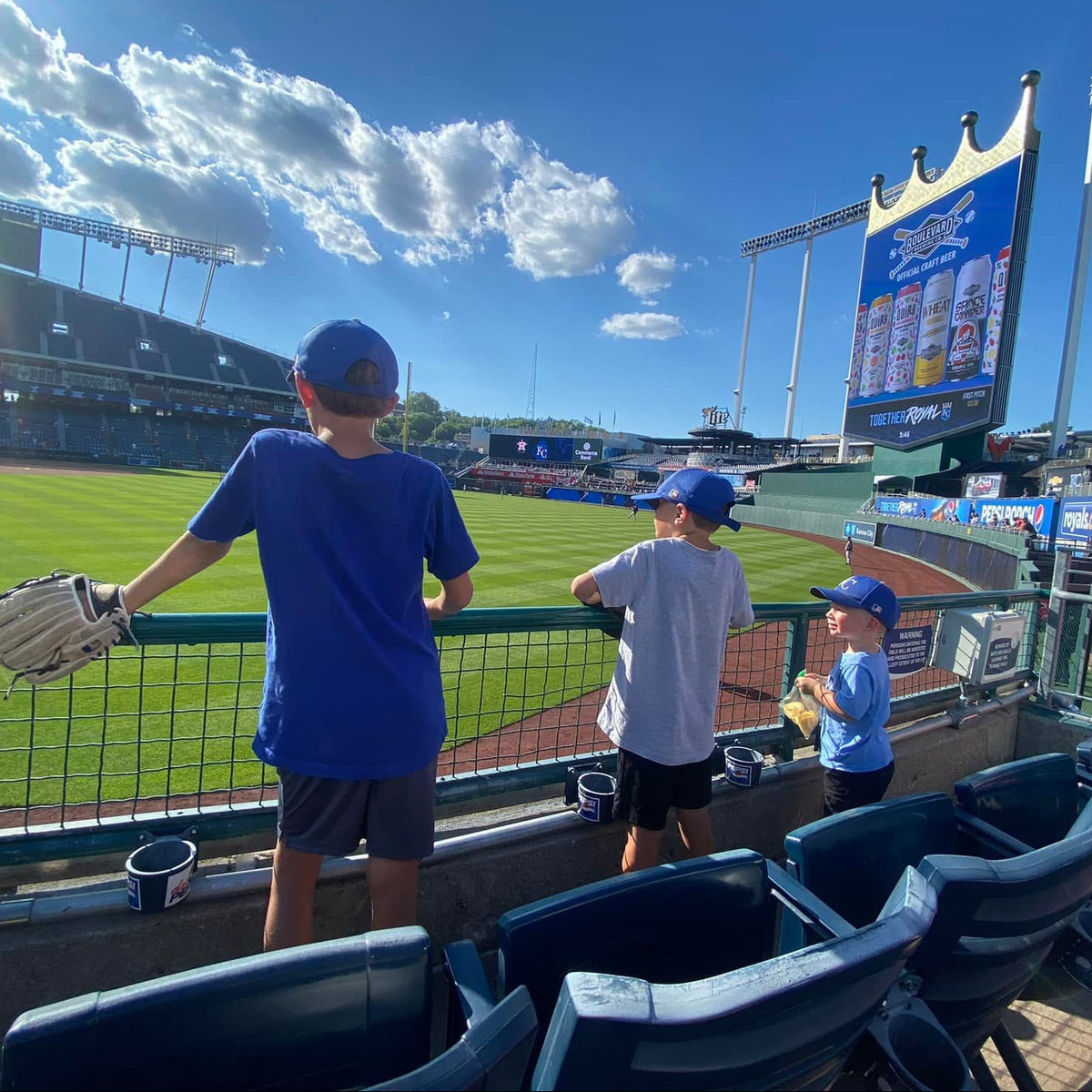 Kids watching batting practice at the Royals stadium