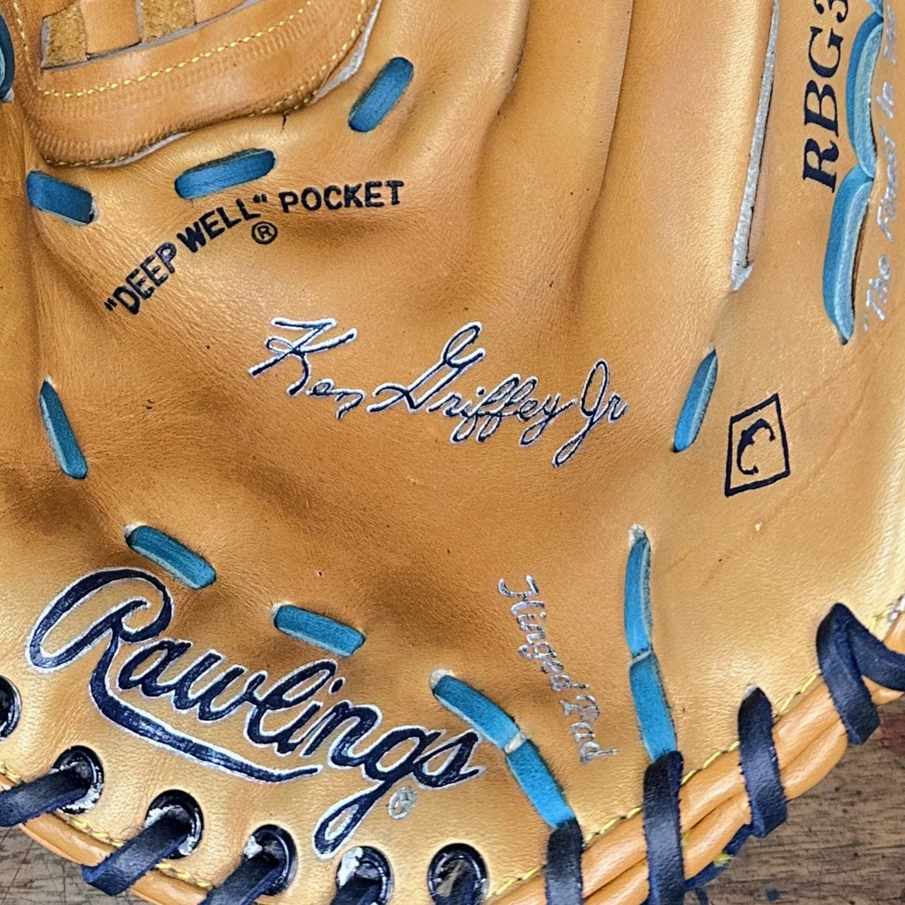 Close-up of the navy-and-silver custom-painted leather on the vintage Rawlings glove