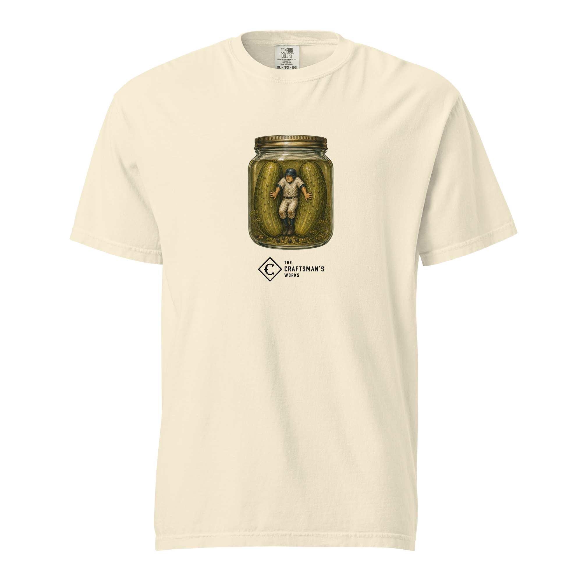 In a Pickle Baseball Lexicon shirt printed on an Ivory Comfort Colors t-shirt featuring a baseball runner trapped between two pickles inside a pickle jar.