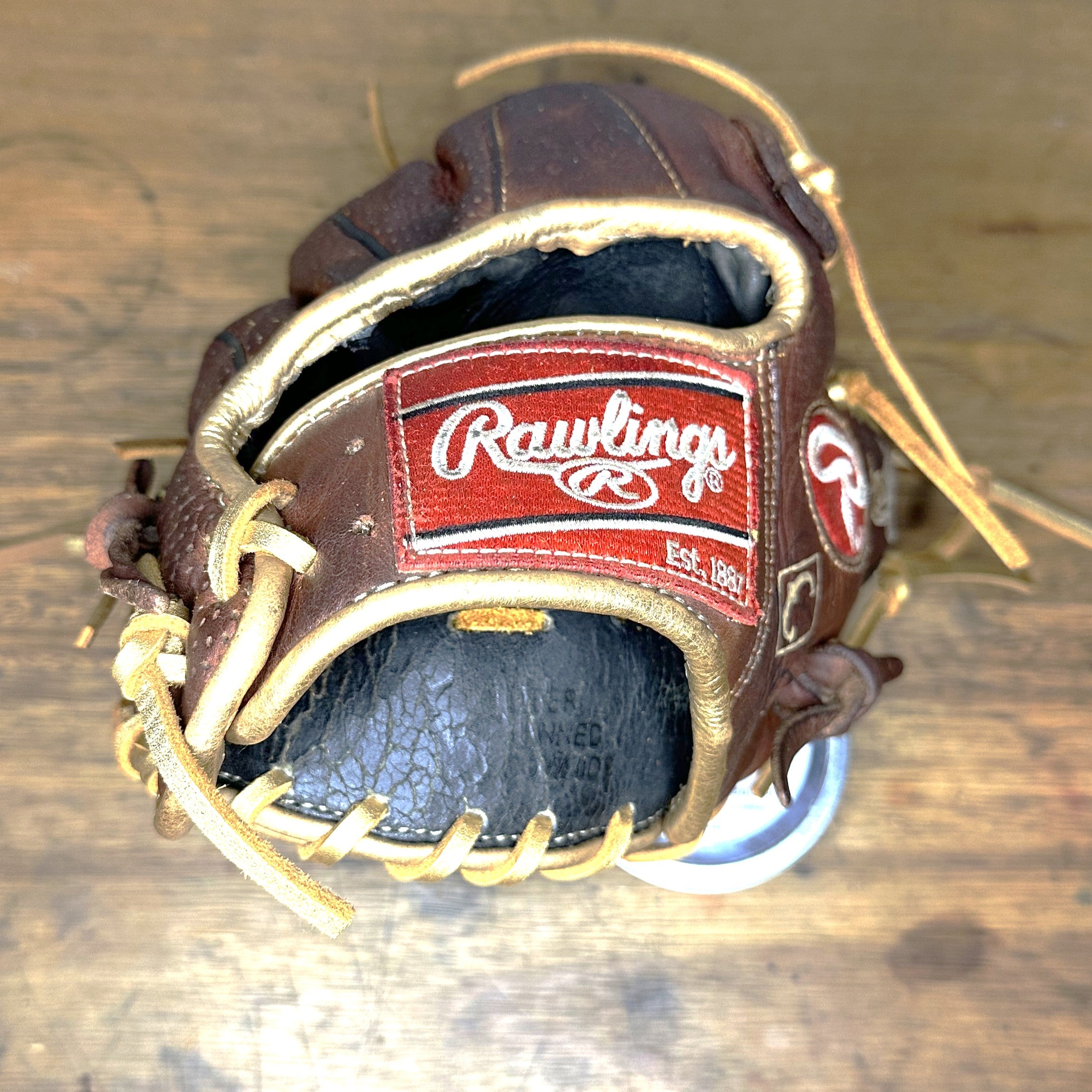 Rawlings Heart of the Hide Sanotan PRO200-4S baseball glove showing Rawlings wrist patch, gold laces, and restored gold binding on custom 11.5 inch infield glove