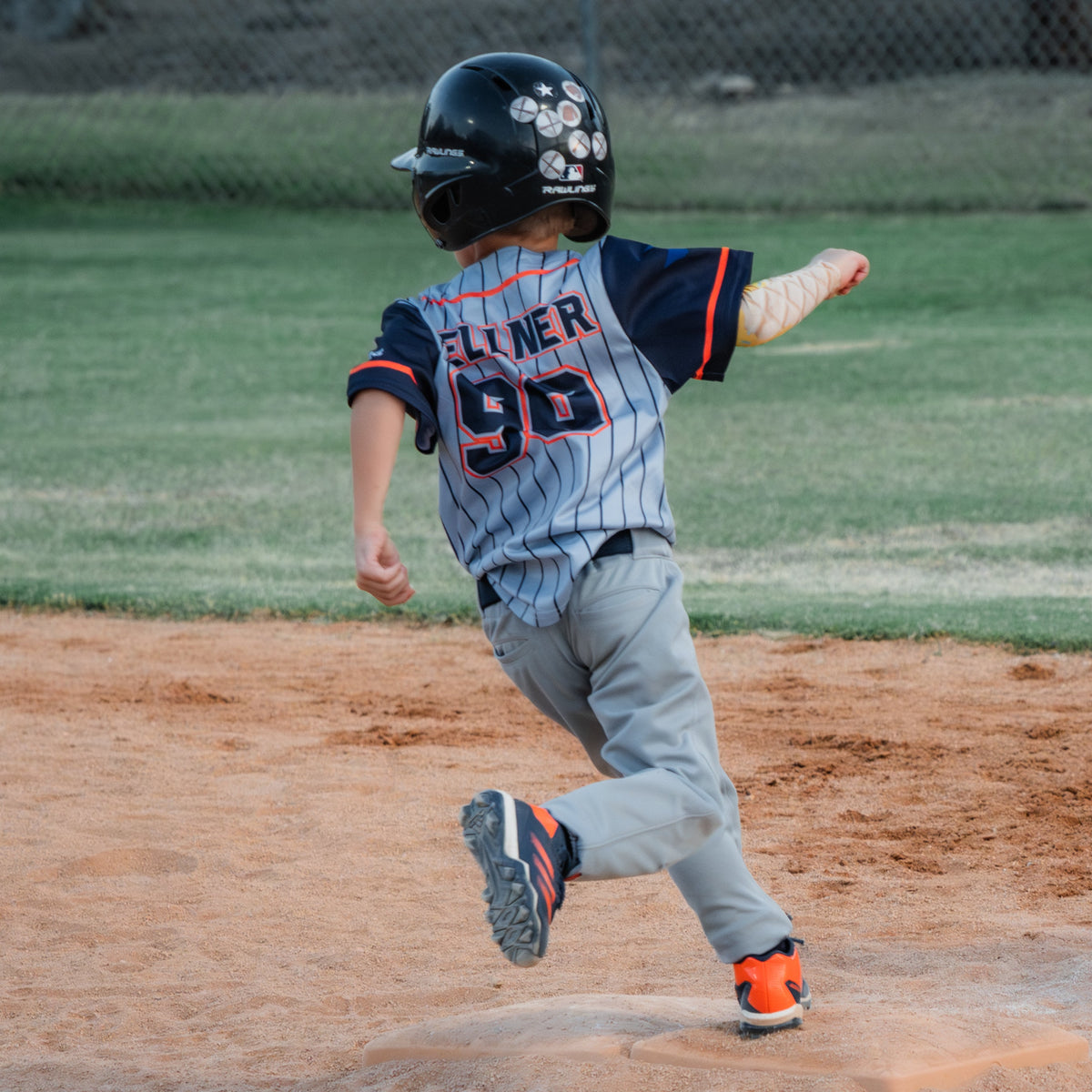 A picture of a t-ball baseball player running