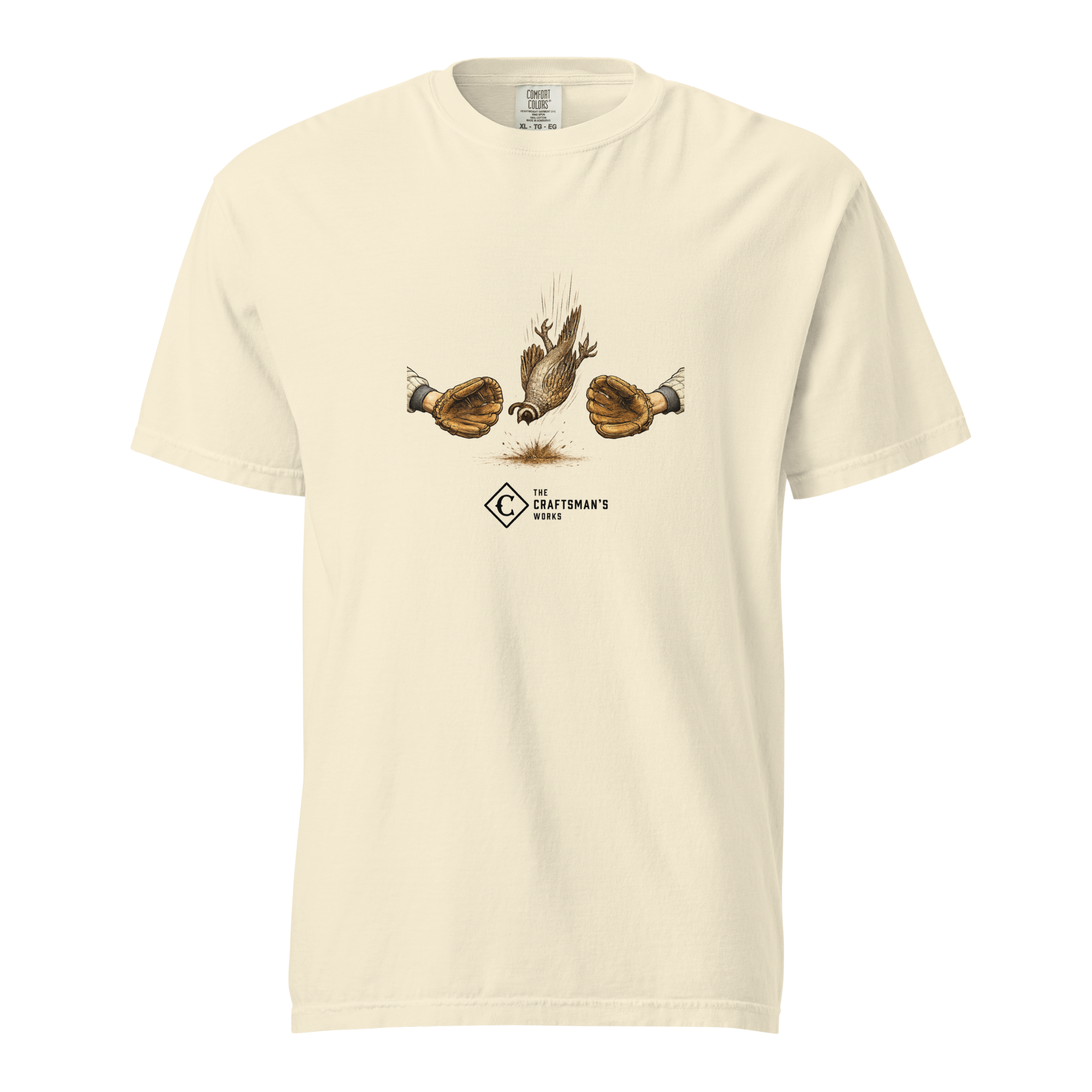 Dying Quail Baseball Lexicon shirt printed on an Ivory Comfort Colors t-shirt featuring a quail falling between two baseball gloves.